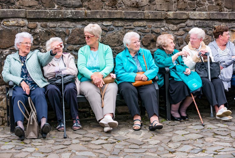 Older adults sitting in a row.