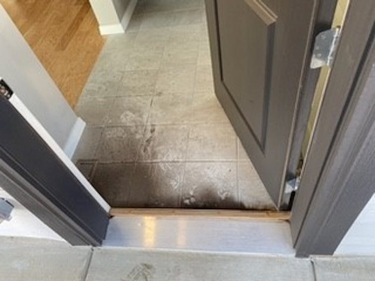 Ash door under threshold.