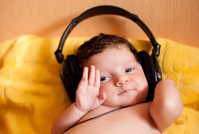 Portrait of happy baby with headphones