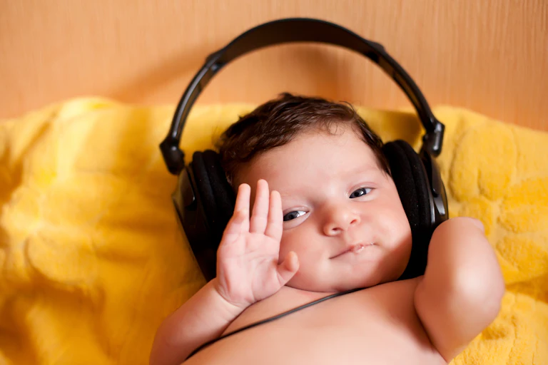 Portrait of happy baby with headphones