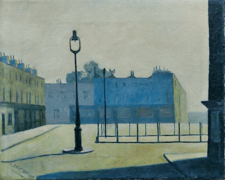 An empty city market square showing some grand terraced houses and a solitary lamppost.