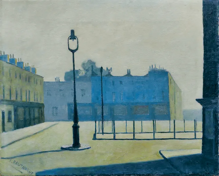 An empty city market square showing some grand terraced houses and a solitary lamppost.