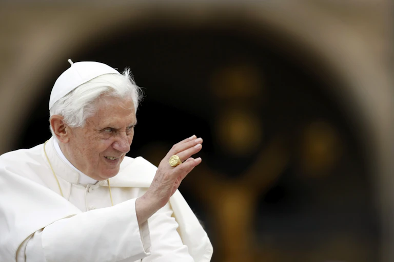 Pope Benedict XVI wearing white priestly robe.