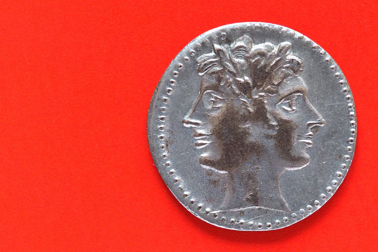 a coin showing a two-faced god.