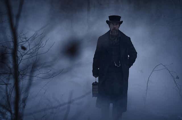 Christian Bale as Augustus Landor walking in a foggy landscape