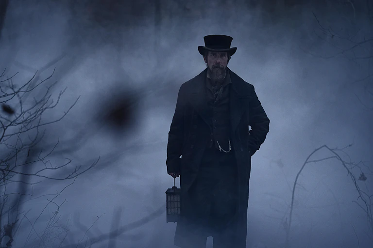 Christian Bale as Augustus Landor walking in a foggy landscape