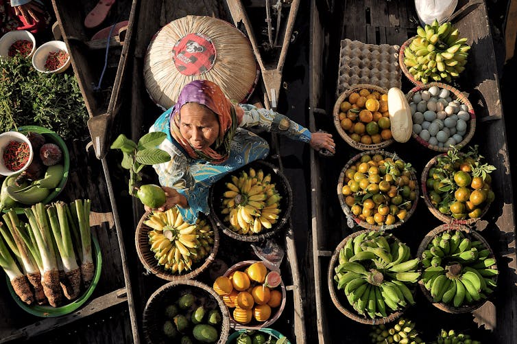 Banjarmasin, September 2012. A trader from lok baintan offer guava fruit in the Floating Culture Festival in Banjarmasin.