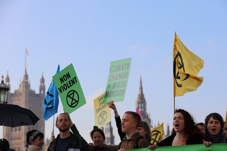 Protesters with UK parliament building in background