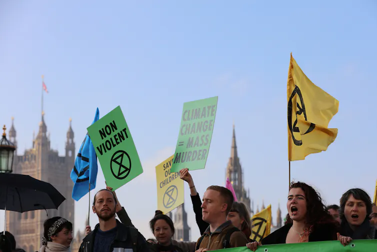 Protesters with UK parliament building in background