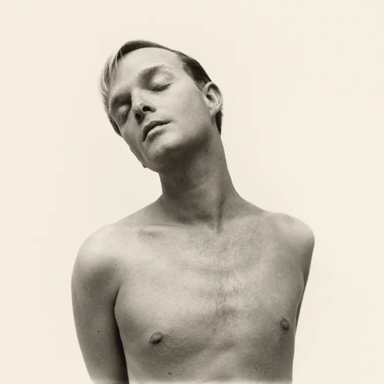 Portrait of shirtless young man closing his eyes.