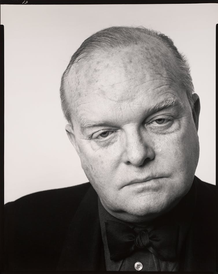 Close-up portrait of balding man.