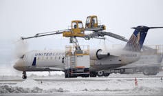 An airplane is sprayed with deicing fluid