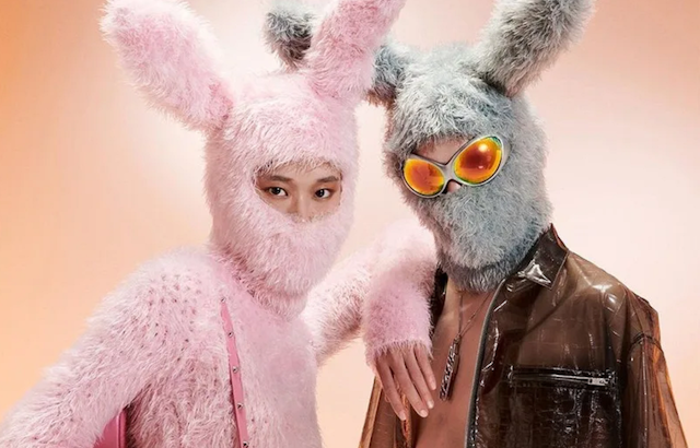 A young Chinese couple wearing rabbit balaclavas