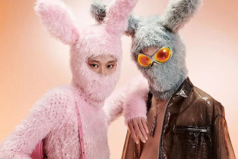 A young Chinese couple wearing rabbit balaclavas