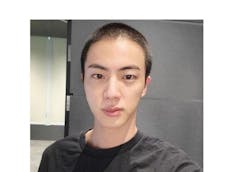 A young Korean man with a new army buzzcut.