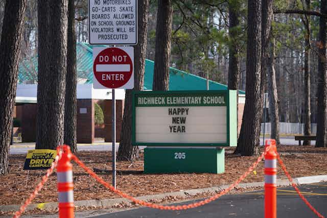 A sign in front of Richneck Elementary School states: "Happy New Year."