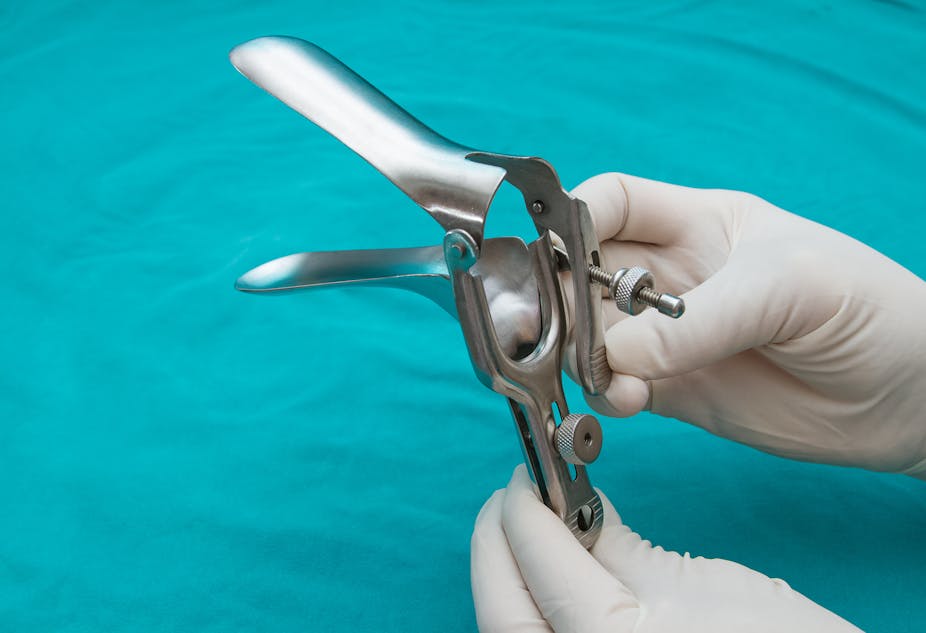 Doctor holds a disposable speculum in their hand.