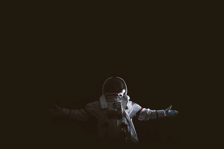 Astronaut against black background