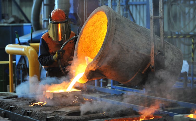 A person smelting steel