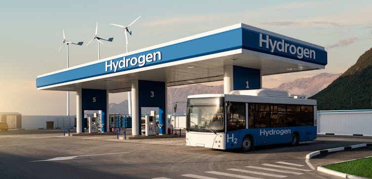 An artist's impression of a bus leaving a hydrogen fuelling station.