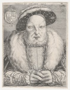 White man wearing luxurious clothing and a broad fur collar.