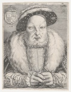 White man wearing luxurious clothing and a broad fur collar.