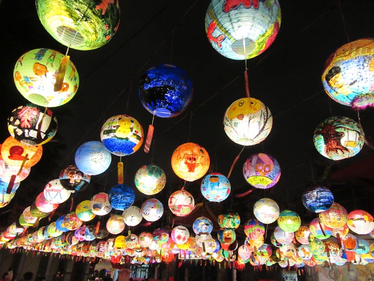 Round paper lanterns with colorful decorations