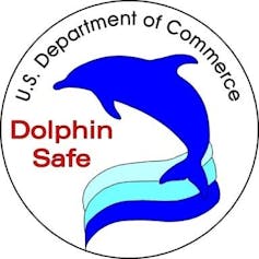 Label with an image of a dolphin and 'U.S. Department of Commerce/Dolphin Safe.'