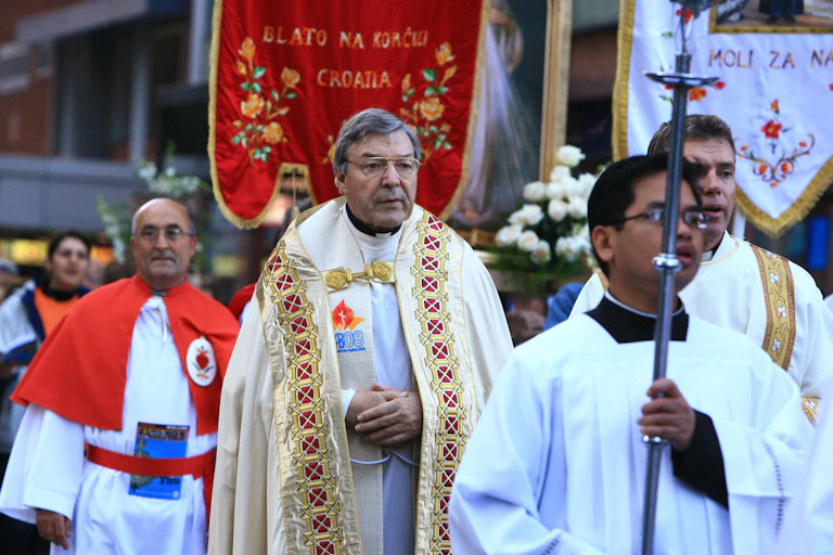 George Pell wears robes at a Catholic ceremony.