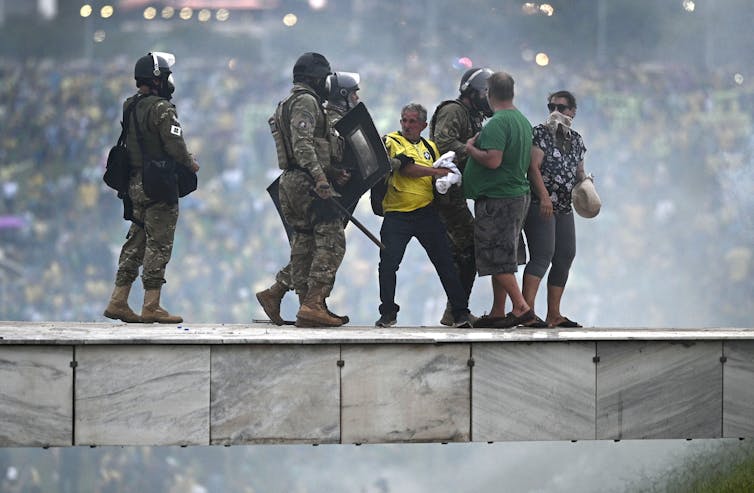 Police clash with Bolsonaro supporters in Brasilia