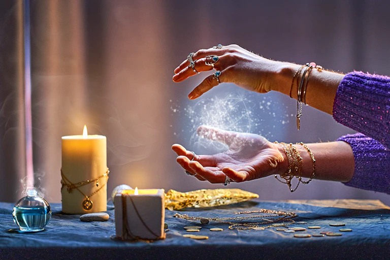 Magical luminous swirling glowing ball in the palm of a woman.