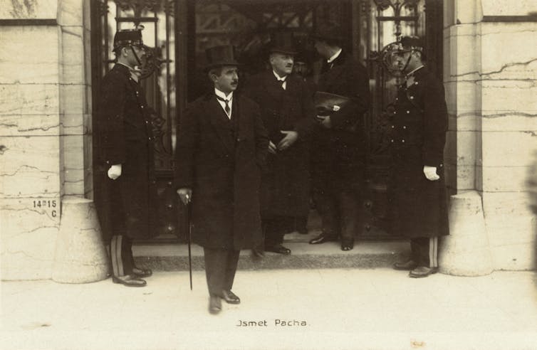 A man with a top hat and walking stick