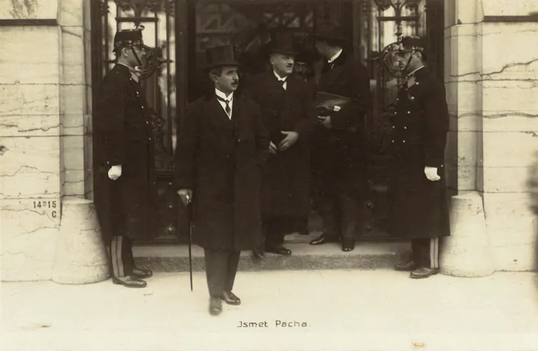 A man with a top hat and walking stick