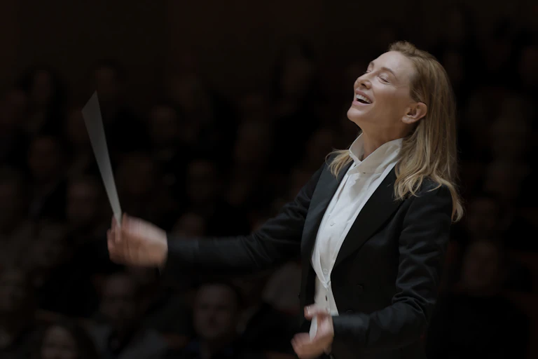A woman conducting.