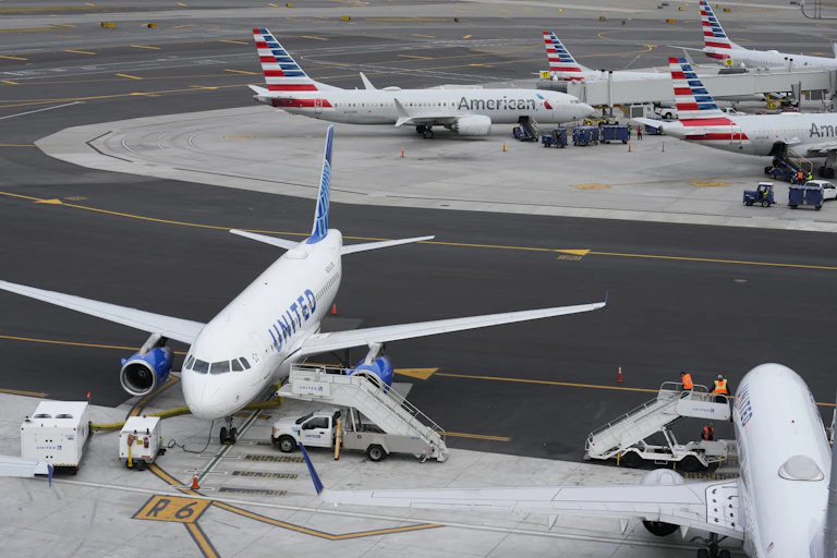 Planes sitting at gates.