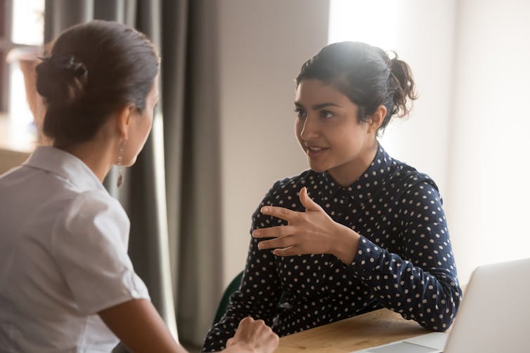 Two women having a serious conversation