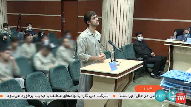 A grab taken from Iranian state TV showing an Iranian man facing court