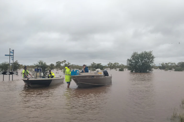 Two emergency rescue boats on floodwaters in the Kimberley
