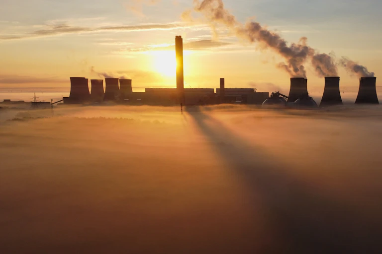 Power plant above mist at sunrise