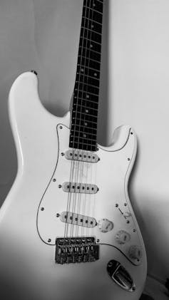 A white Stratocaster guitar.
