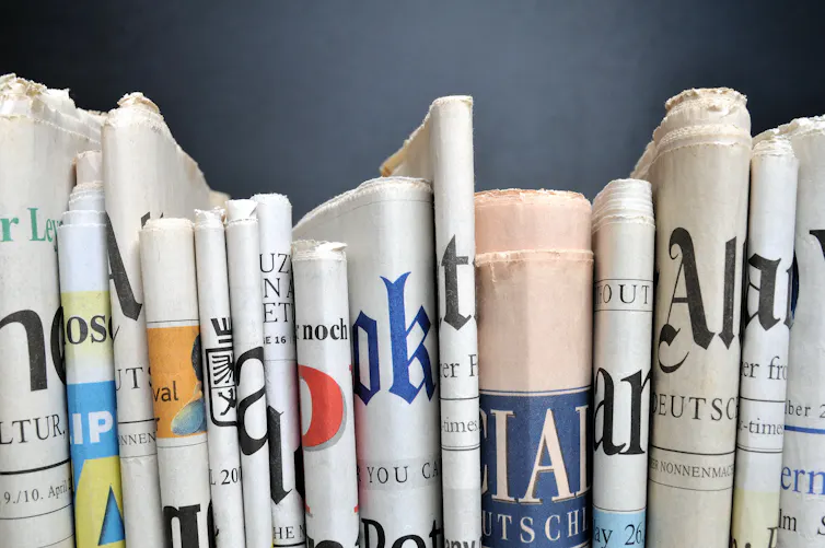 A row of newspapers.
