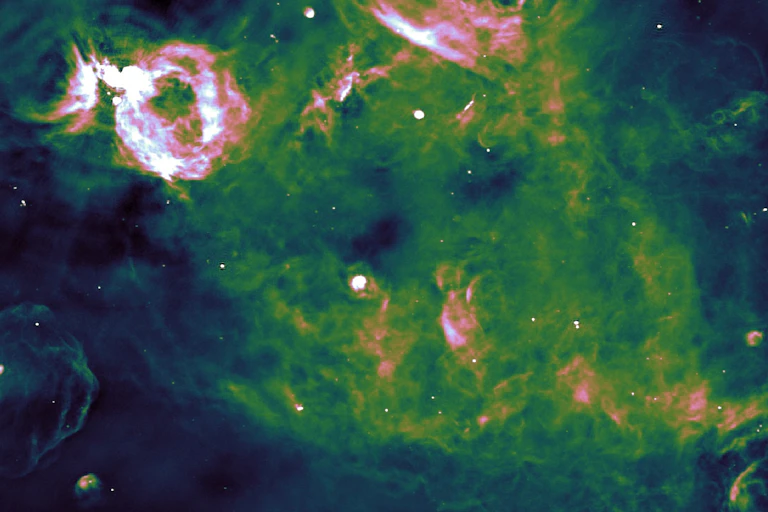 A navy and green cloudy image with brighter white areas in it