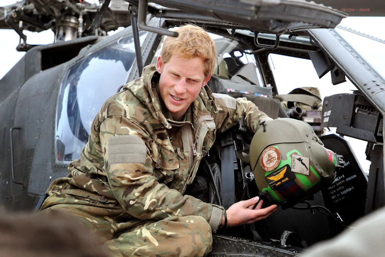 2012 photo of Prince Harry making pre-flight checks on a helicopter in Afghanistan during his military service