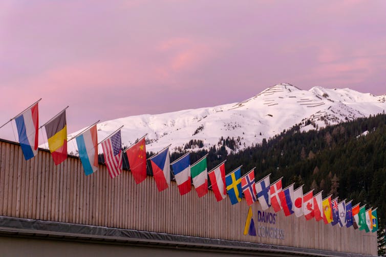 14 January 2020: the congress center in Davos with flags of nations at sunrise during the WEF World Economic Forum