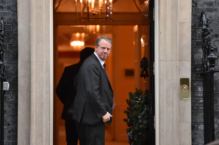 Alister Jack looking around from the door of Downing Street.