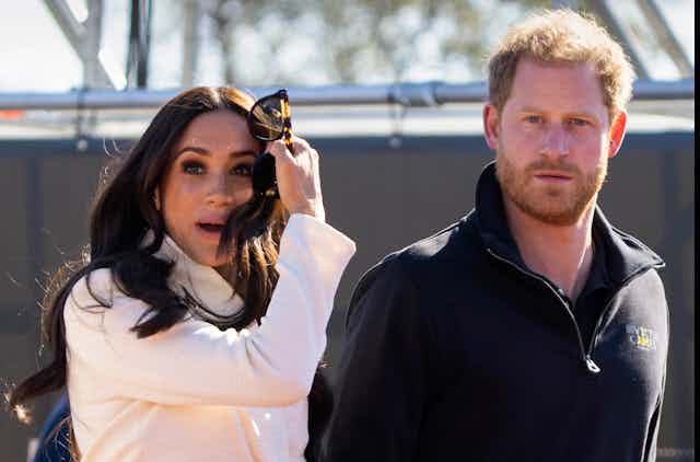 Meghan and Harry, looking hunted