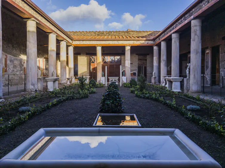 A light beautiful courtyard surrounded by columns.