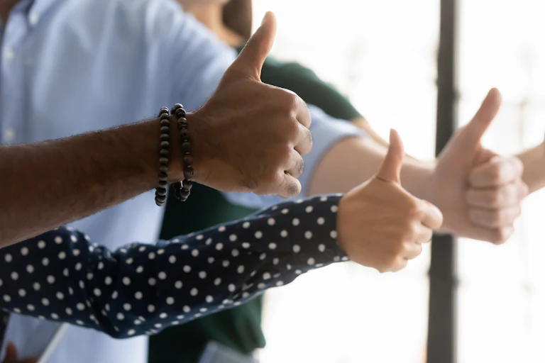 People seen with thumbs up.