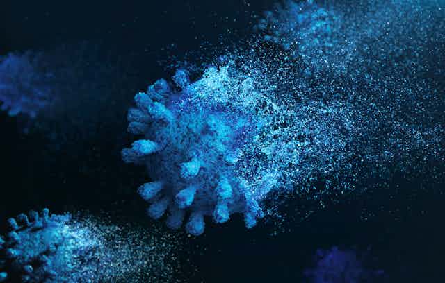 An image of a fading COVID virus
