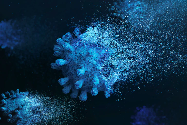 An image of a fading COVID virus